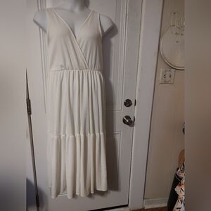 Sleeveless Cream Maxi Dress with V-Neck and Tiered Skirt